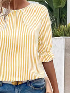 Women's striped ruffled round neck half sleeve blouse from Trendsi, featuring a stylish design with ruffles and a comfortable fit.