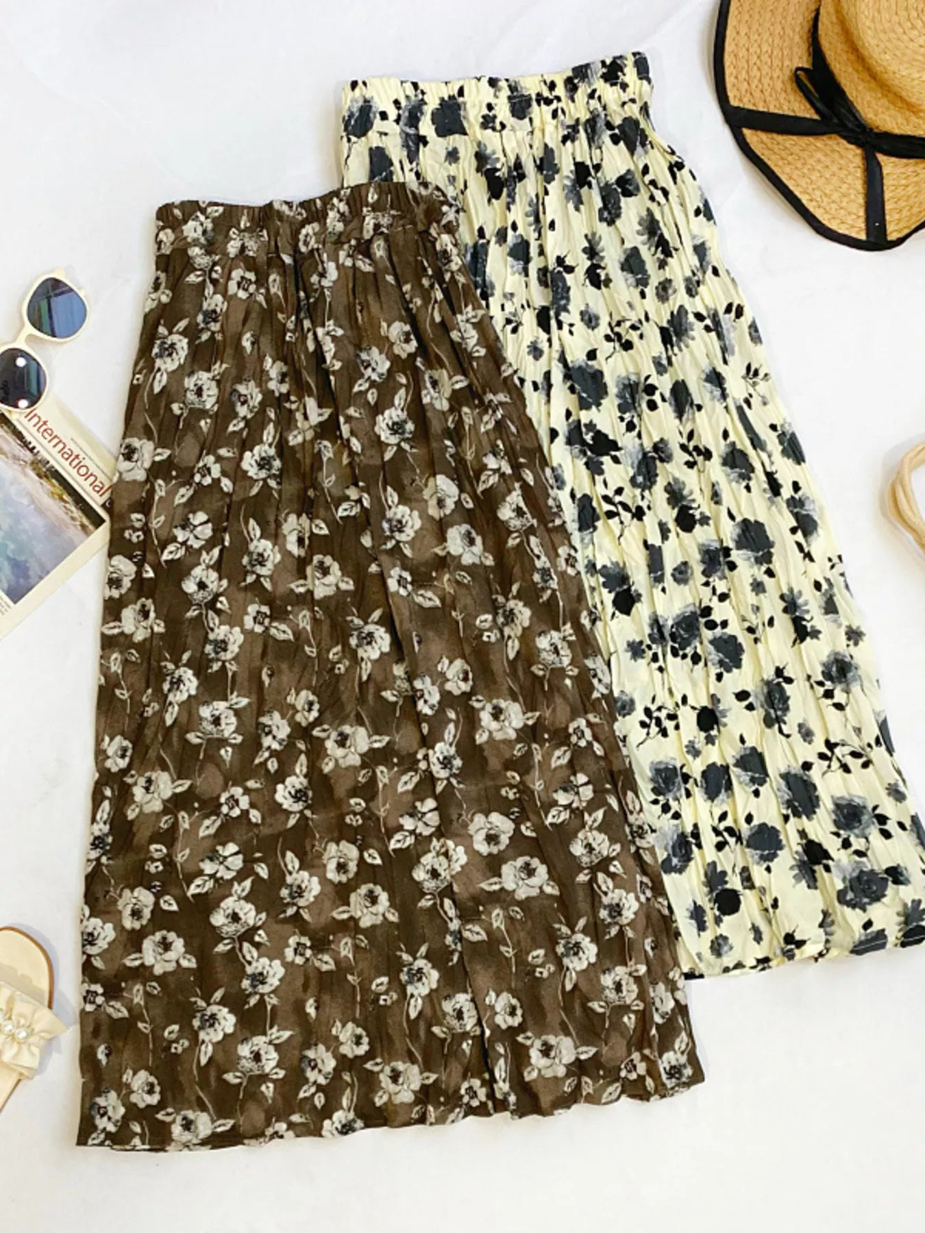 Floral print elastic waist midi skirt by Trendsi, showcasing flowing fabric and vibrant flower patterns perfect for spring and summer.