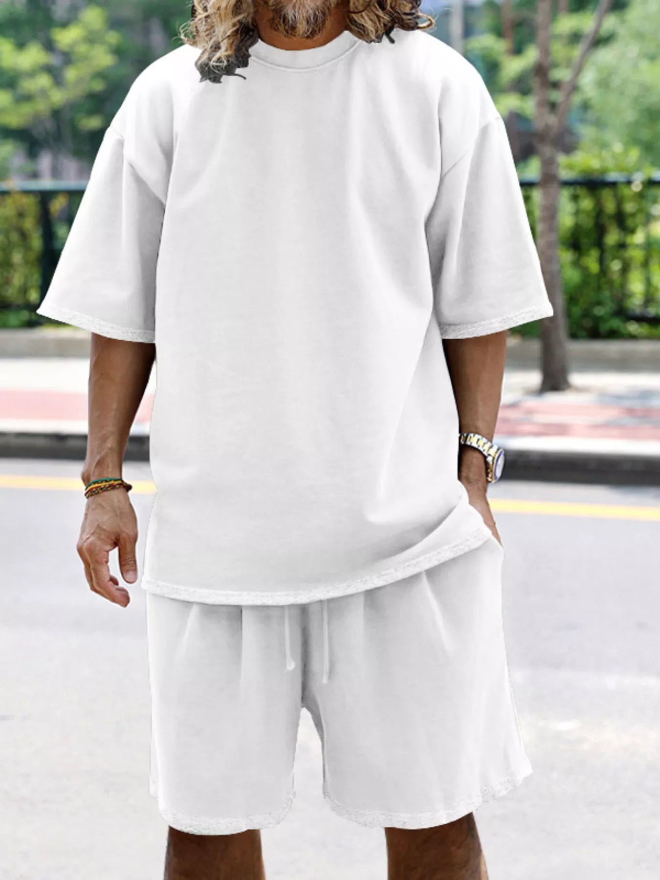 Men's relaxed fit t-shirt and shorts set in plus size by Trendsi, featuring comfortable, casual loungewear with soft fabric.