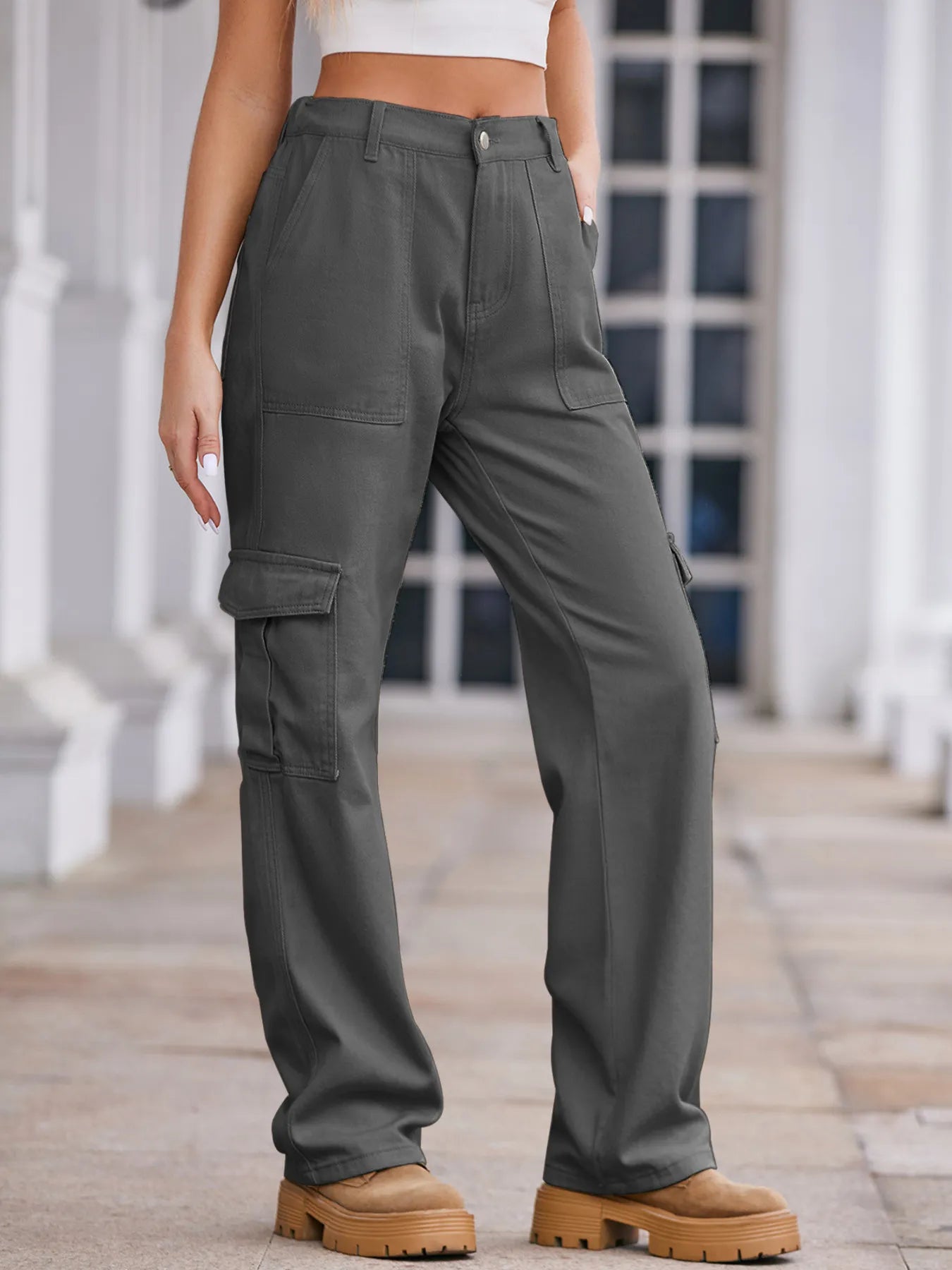 High-waisted plush denim cargo jeans with multiple pockets, styled for a casual look, from Plush Fashion Shop.