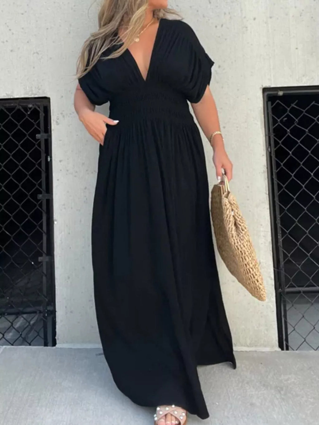 Plus size maxi dress by Trendsi featuring a full size slit, V-neck, smocked waist, and elegant design.