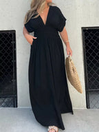 Plus size maxi dress by Trendsi featuring a full size slit, V-neck, smocked waist, and elegant design.
