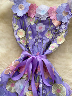 Floral embroidered tie waist mini dress by Trendsi featuring an elegant summer A-line silhouette and floral embroidery details.