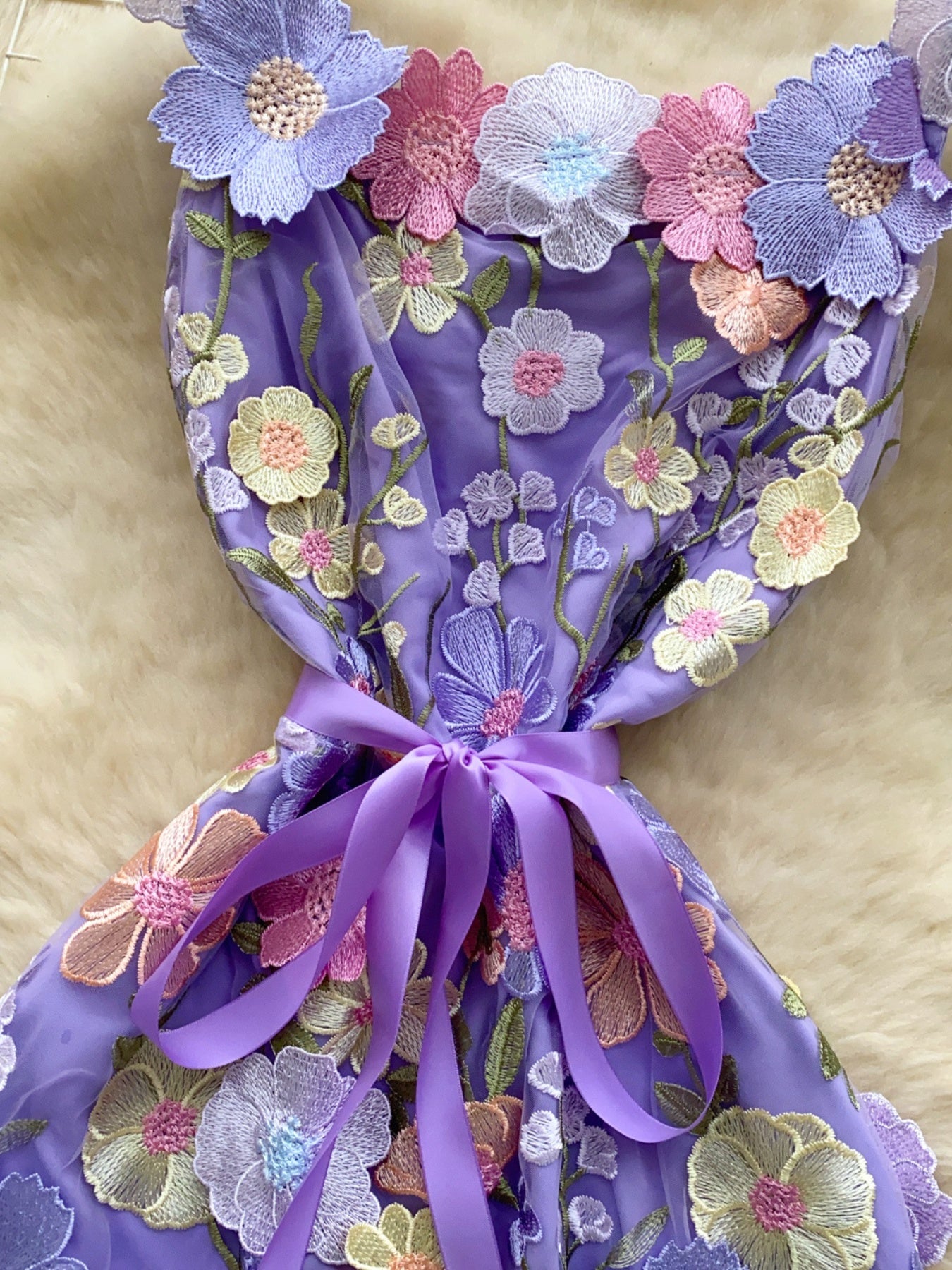 Floral embroidered tie waist mini dress by Trendsi featuring an elegant summer A-line silhouette and floral embroidery details.