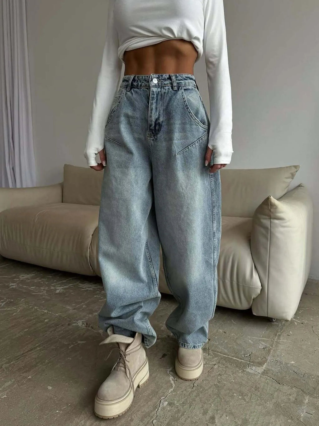 Plush Fashion Hub wide leg denim jeans with a relaxed fit and classic blue wash, displayed on a model.