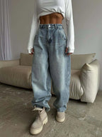 Plush Fashion Hub wide leg denim jeans with a relaxed fit and classic blue wash, displayed on a model.