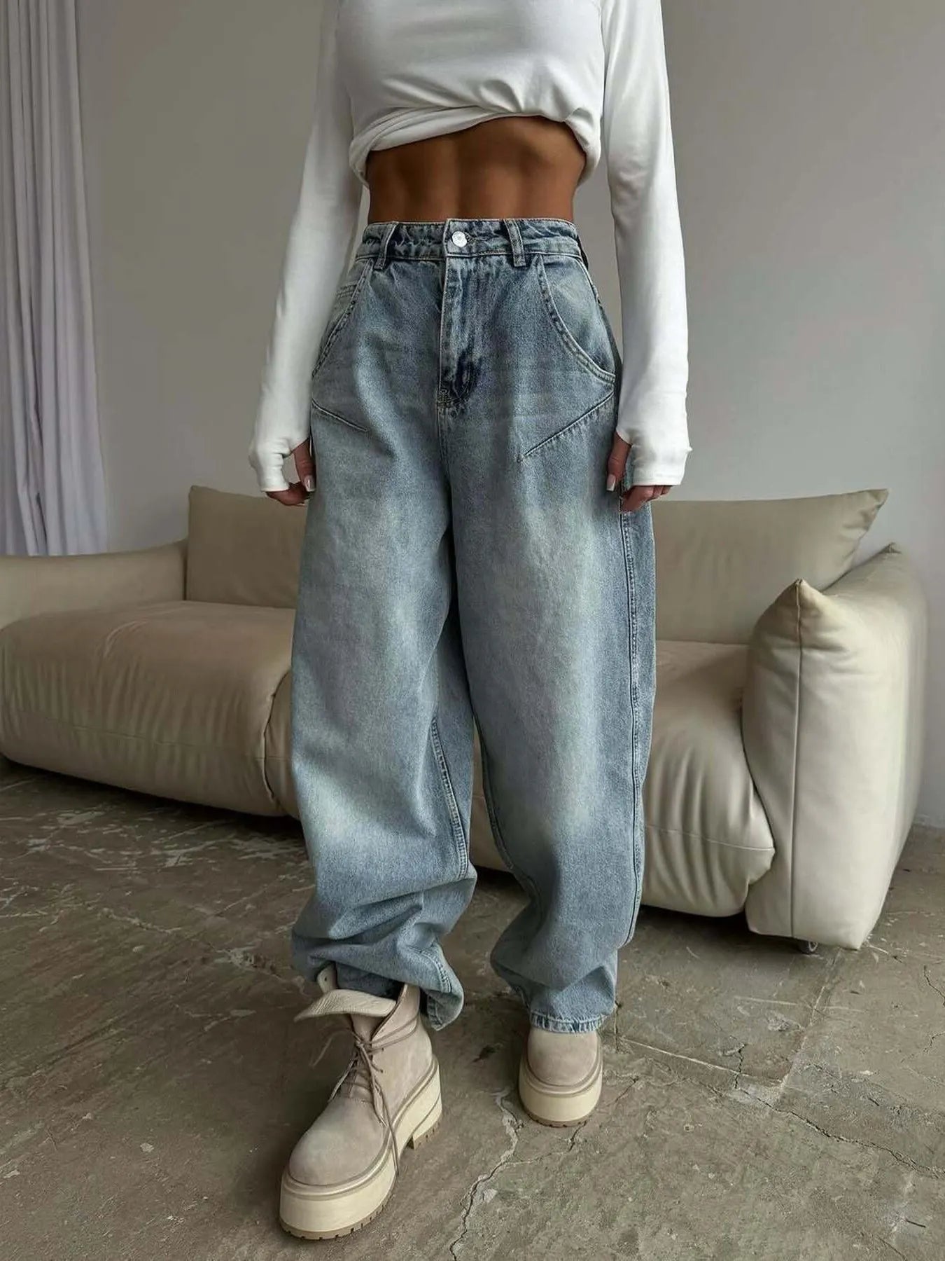 Plush Fashion Hub wide leg denim jeans with a relaxed fit and classic blue wash, displayed on a model.
