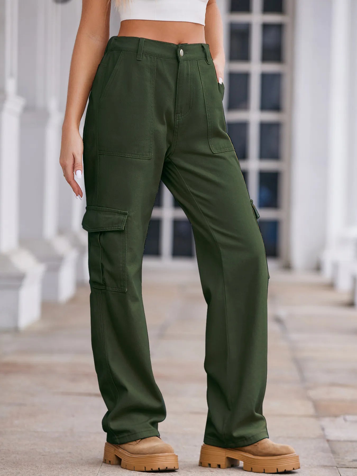 High-waisted cargo denim jeans from Plush Fashion Shop, featuring multiple pockets and a relaxed fit on model.