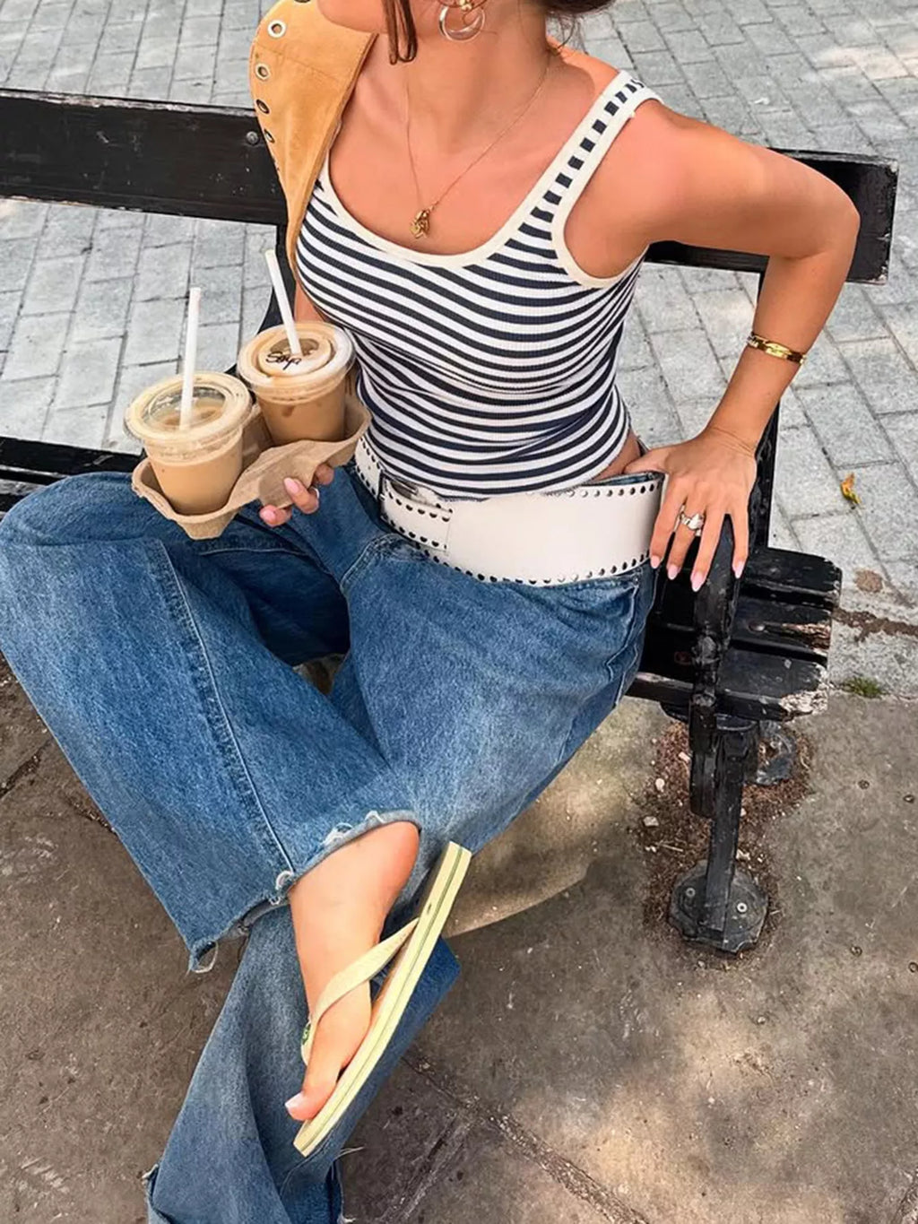 Striped scoop neck tank top from Trendsi featuring horizontal black and white stripes and a relaxed fit.