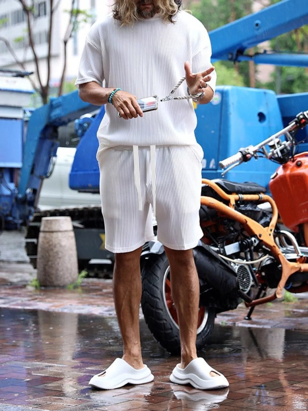Plus size men's short sleeve top and shorts set by Trendsi, featuring a casual, comfortable fit with a stylish design.