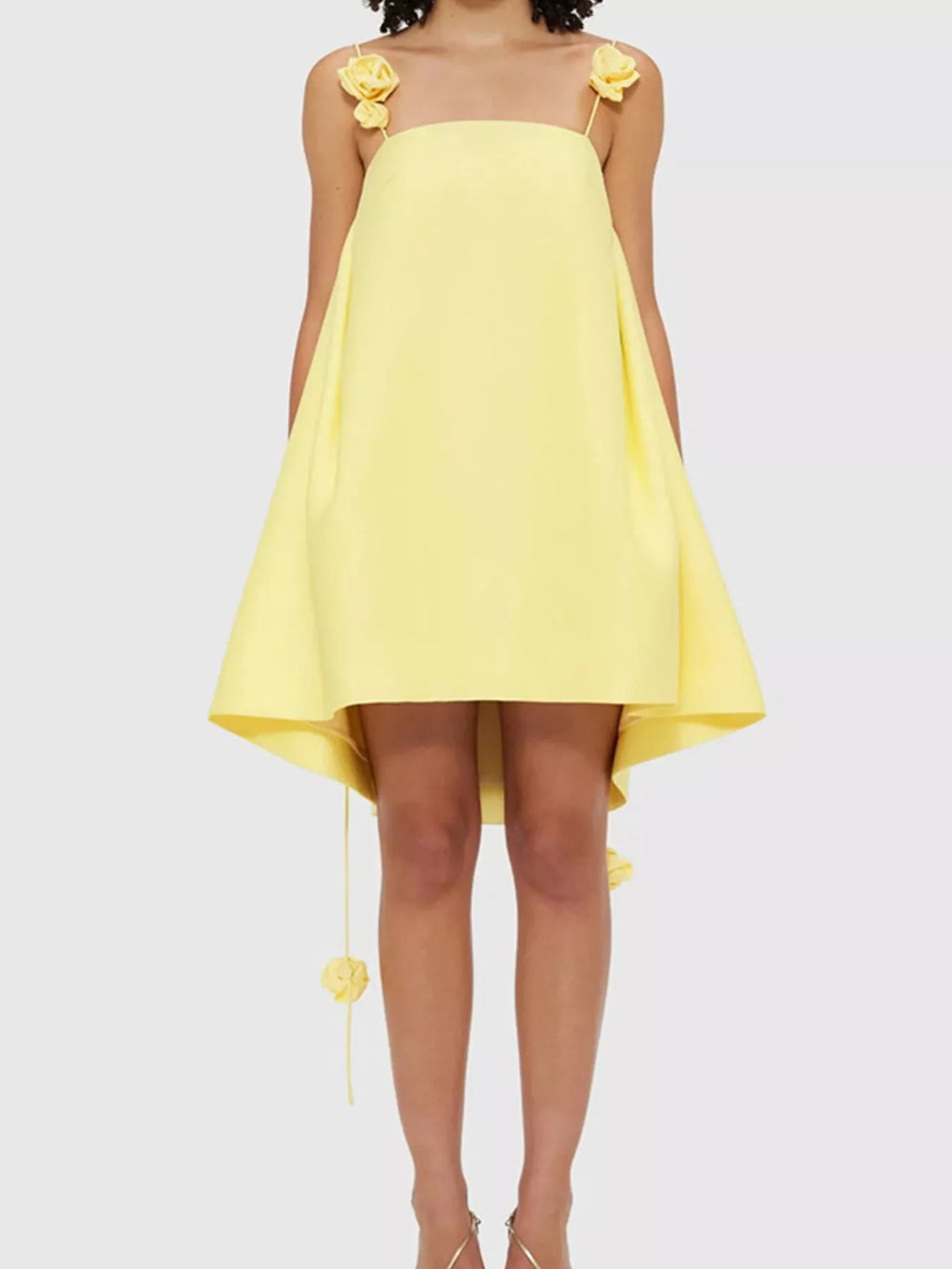 Floral strap mini A-line dress from Trendsi with a fitted bodice and flared skirt, featuring colorful floral patterns.