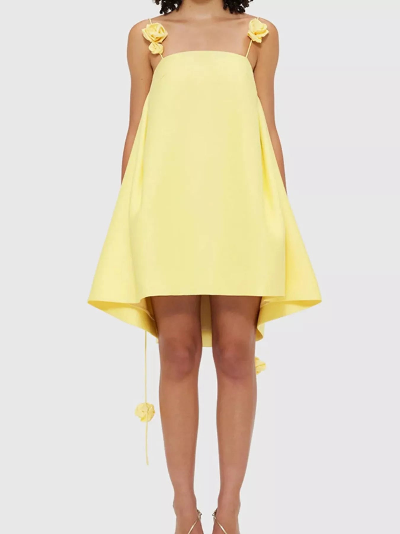 Floral strap mini A-line dress from Trendsi with a fitted bodice and flared skirt, featuring colorful floral patterns.