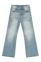 Plush Fashion Hub baggy denim jeans with large front and back pockets, relaxed fit, casual style, in classic blue denim fabric.