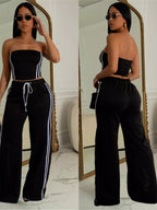 Sleeveless tube top and wide-leg pants set by Trendsi, featuring a stylish matching two-piece outfit with a fitted top and flowy pants.
