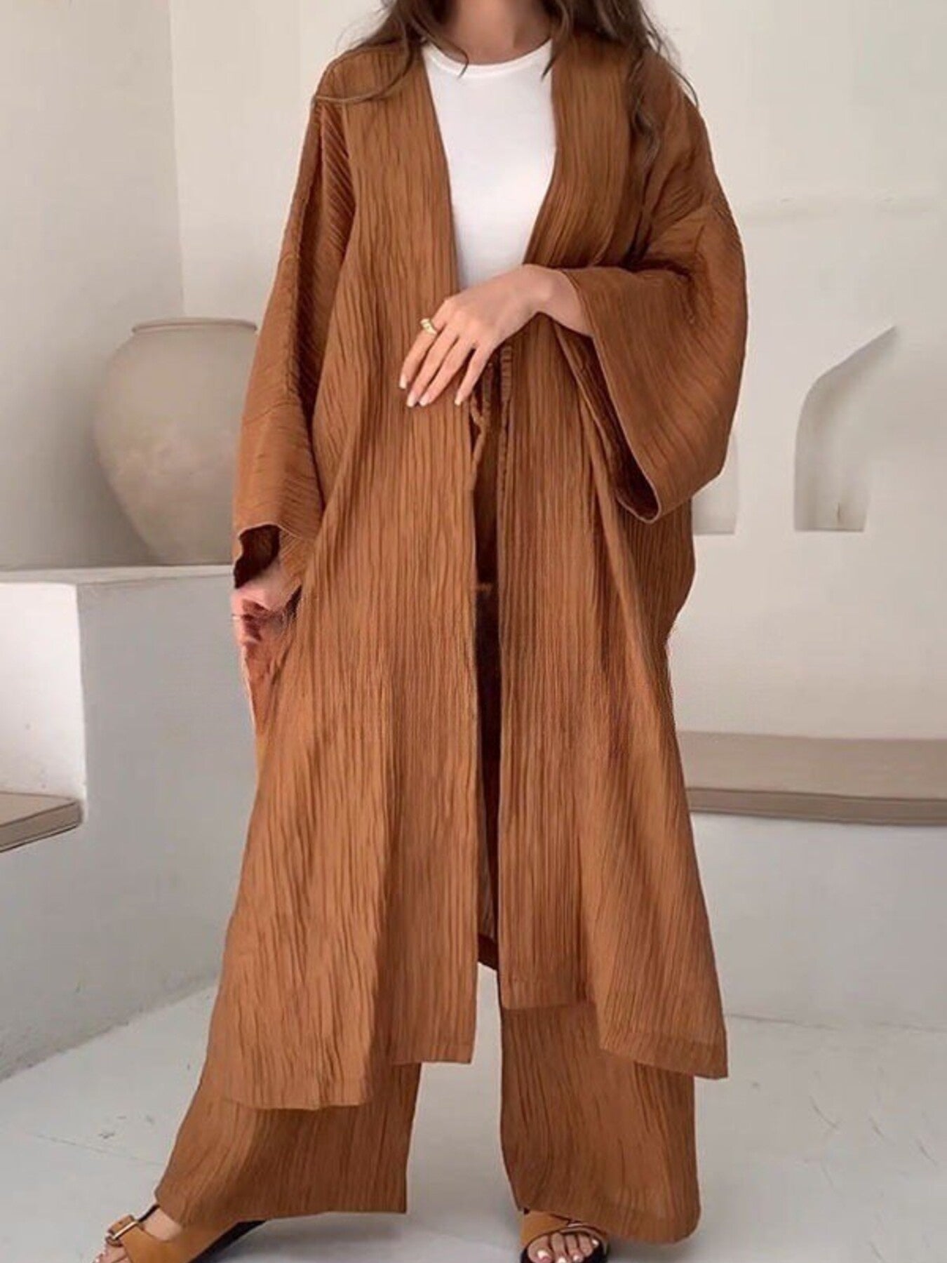 Textured knit women's loungewear set with cardigan and matching pants from Trendsi, featuring cozy, stylish knit fabric.
