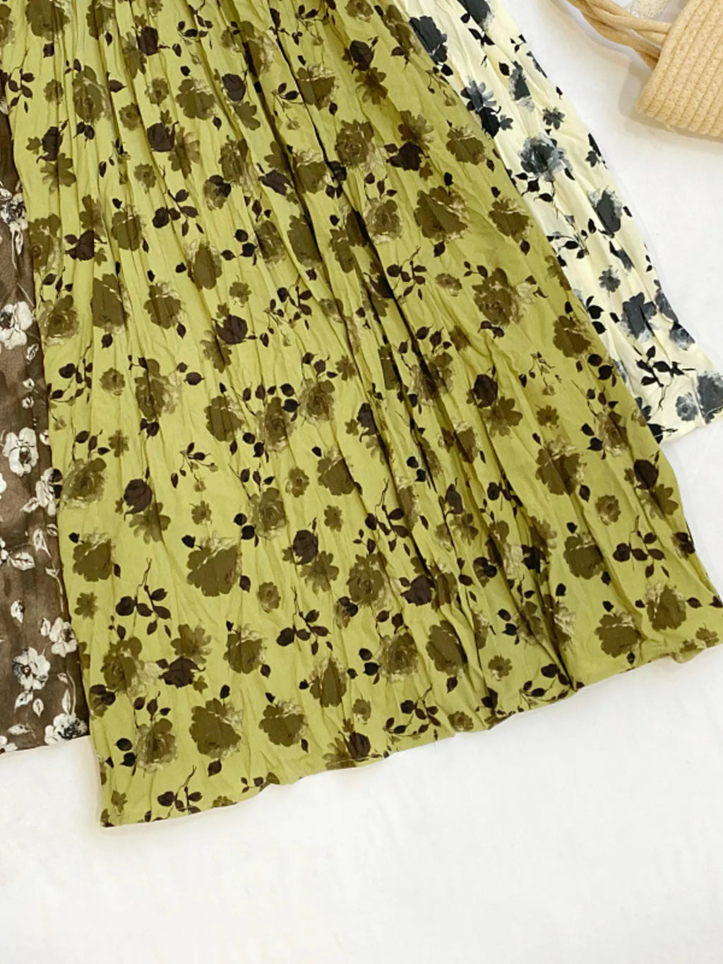 Floral print elastic waist midi skirt from Trendsi, featuring a flowy design and vibrant flower pattern.