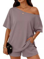 Plus size full size one shoulder top and shorts set by Trendsi, featuring a stylish off-shoulder top and matching shorts.