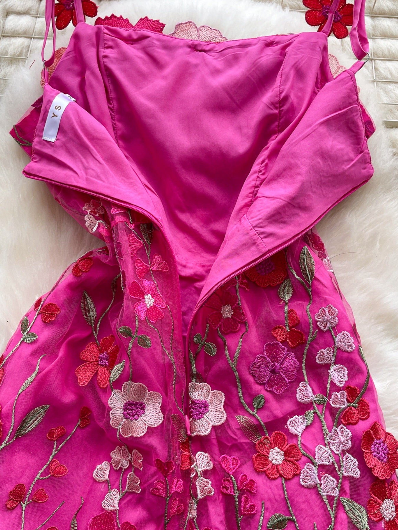 Floral embroidered tie waist mini dress by Trendsi featuring an elegant summer A-line silhouette and floral embroidery details.