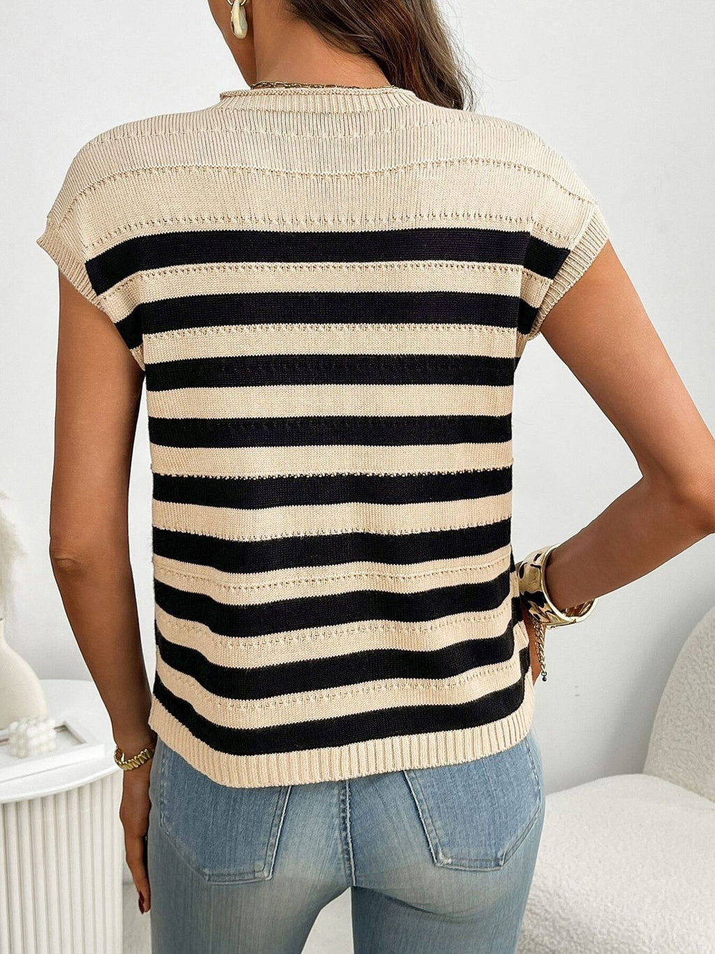 Women's striped knit cap sleeve sweater with pocket detail, featuring a trendy and comfortable design by Trendsi.