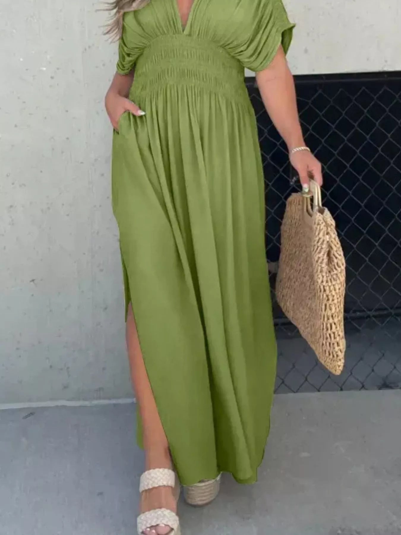 Plus size maxi dress with slit, v-neck, smocked waist, full length, trendy design by Trendsi, perfect for casual or dressy occasions.