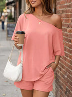 Plus size one-shoulder top and matching shorts set by Trendsi, stylish and comfortable for casual wear.