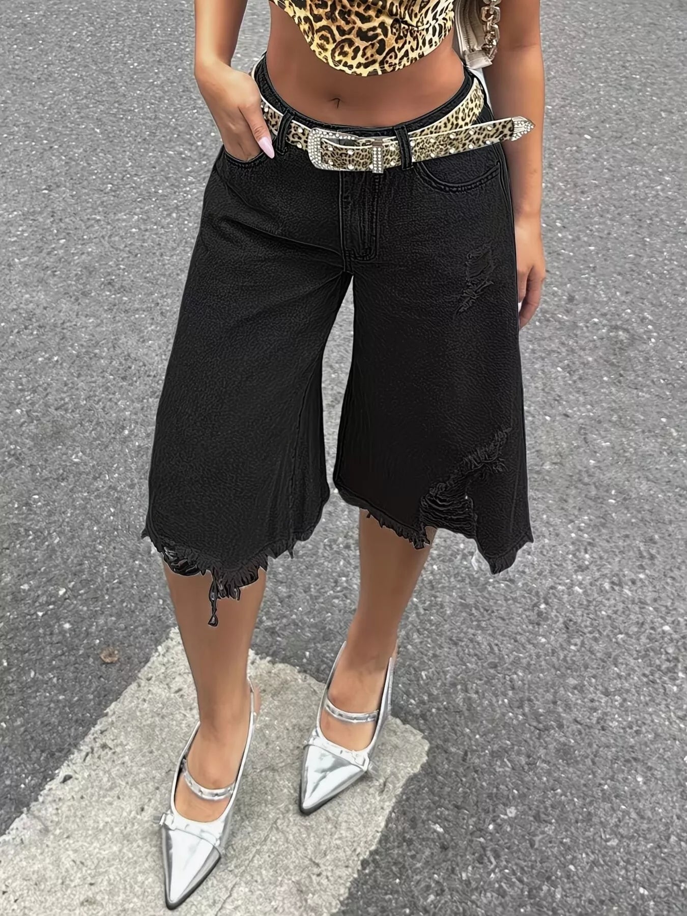 Raw hem distressed denim shorts by Plush Fashion Hub, showcasing frayed edges and ripped details on classic blue denim.