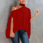 Red one-shoulder tunic with choker neck, metallic gold hardware detail, and loose, split-sleeve design.