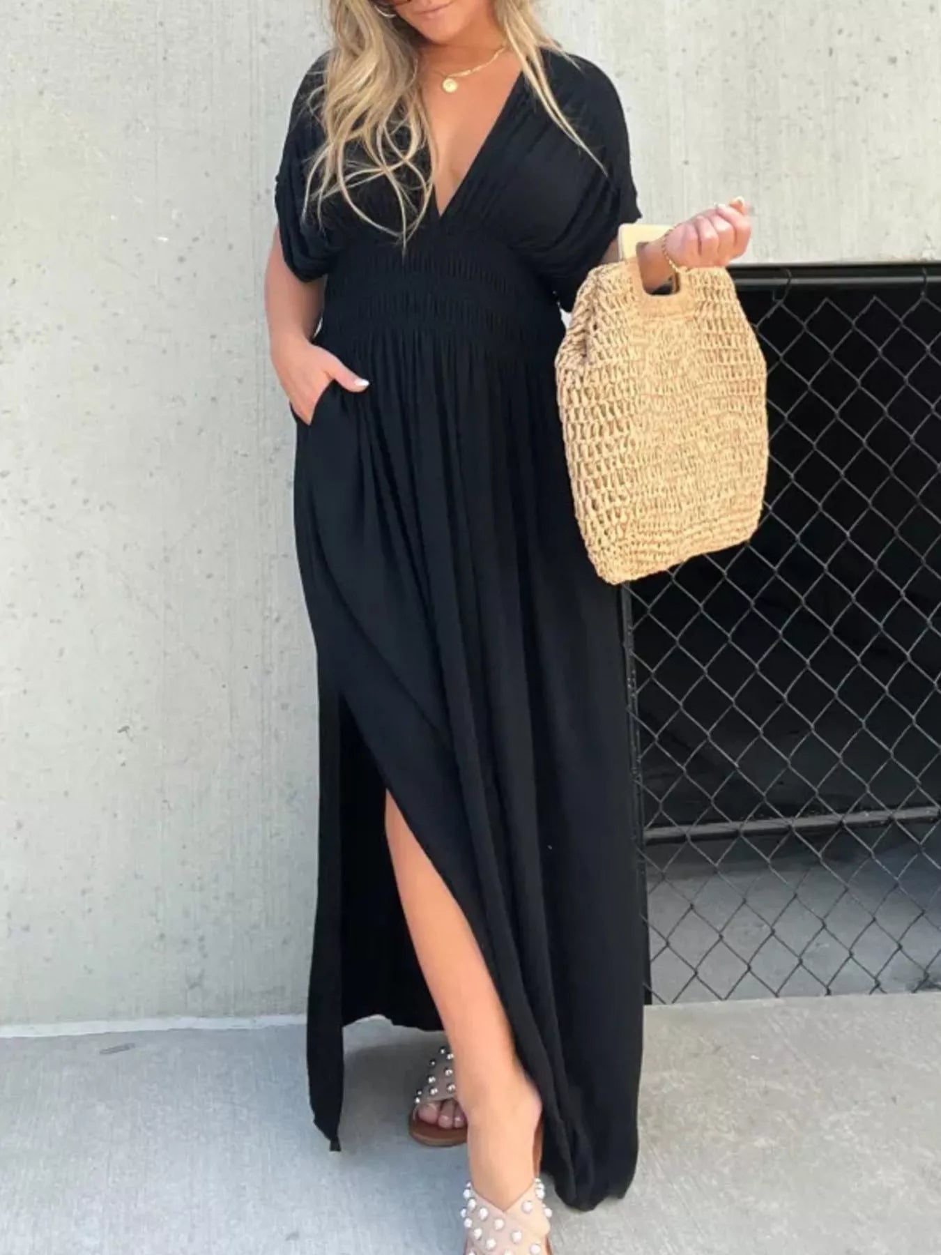Plus size maxi dress with slit V-neck, smocked waist, and flowy fabric by Trendsi, shown in a full-length view.