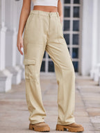 High-waisted Plush Fashion Shop denim cargo jeans with multiple pockets and a relaxed fit, shown on a model.