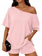Plus size full size one shoulder top and shorts set from Trendsi, featuring a stylish single-shoulder blouse and matching shorts.