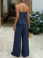 Lace trim cami and wide-leg pants set by Trendsi, featuring a delicate lace camisole and flowing wide-leg trousers.