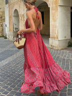 Tiered halter neck maxi dress by Trendsi featuring a flowing, layered design and a stylish halter neckline, perfect for summer occasions.