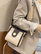 Crocodile embossed wide strap crossbody bag in premium PU leather, featuring a sleek design and adjustable shoulder strap.