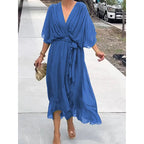 Batwing sleeve V-neck midi dress with tied irregular hem from Plush Fashion Hub, featuring a flowy, fairy-style silhouette.