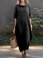 Full-length casual loose fit round neck midi dress with pockets by Plush Fashion Hub, plus size, in a soft, comfortable fabric.