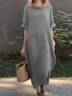 Full-length casual loose fit round neck midi dress with pockets in plus size by Plush Fashion Hub, styled for everyday wear.