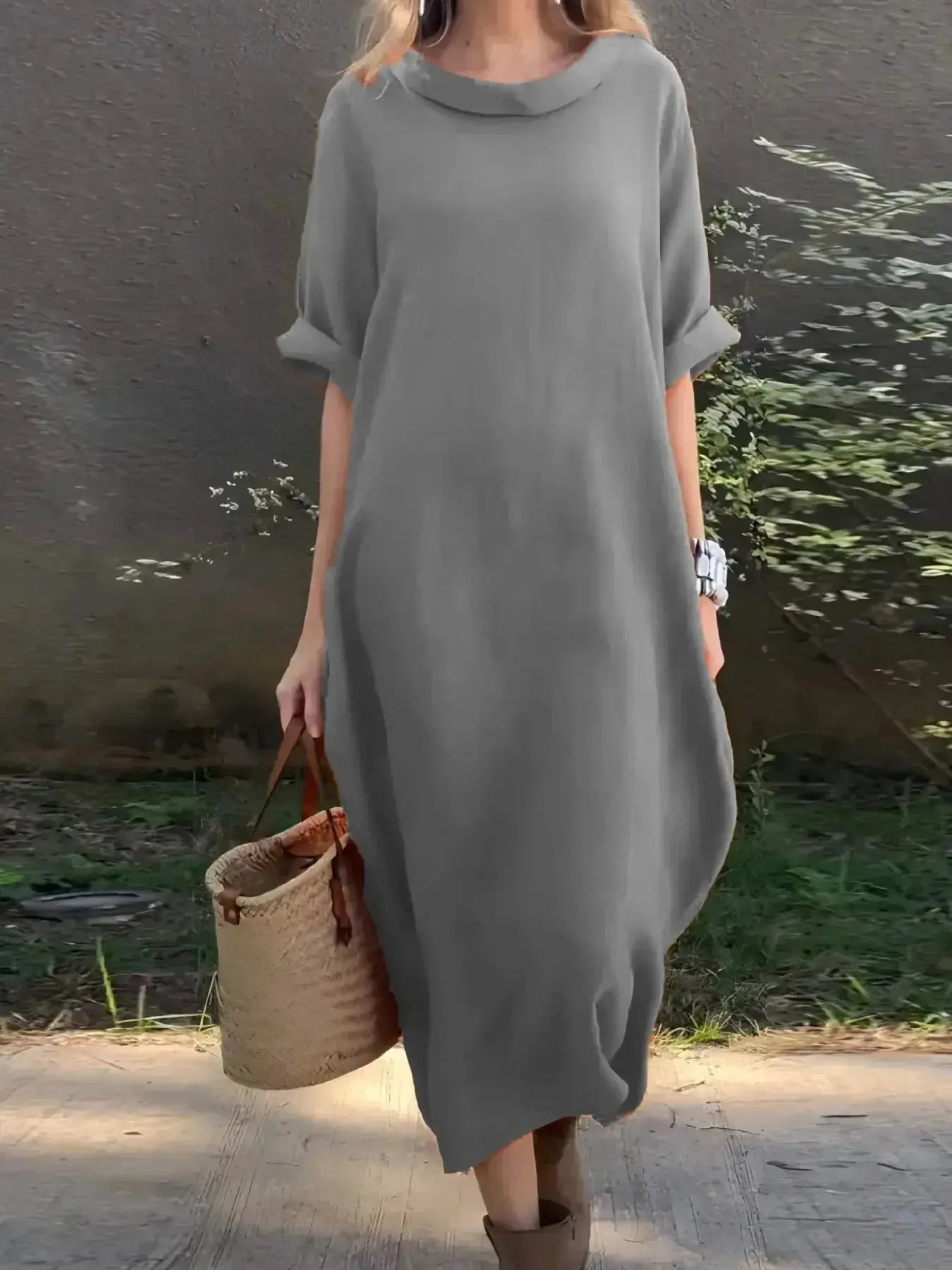 Full-length casual loose fit round neck midi dress with pockets in plus size by Plush Fashion Hub, styled for everyday wear.