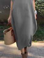 Full-length image of Plush Fashion Hub casual loose fit round neck midi dress with pockets, showing its relaxed style and plus-size fit.