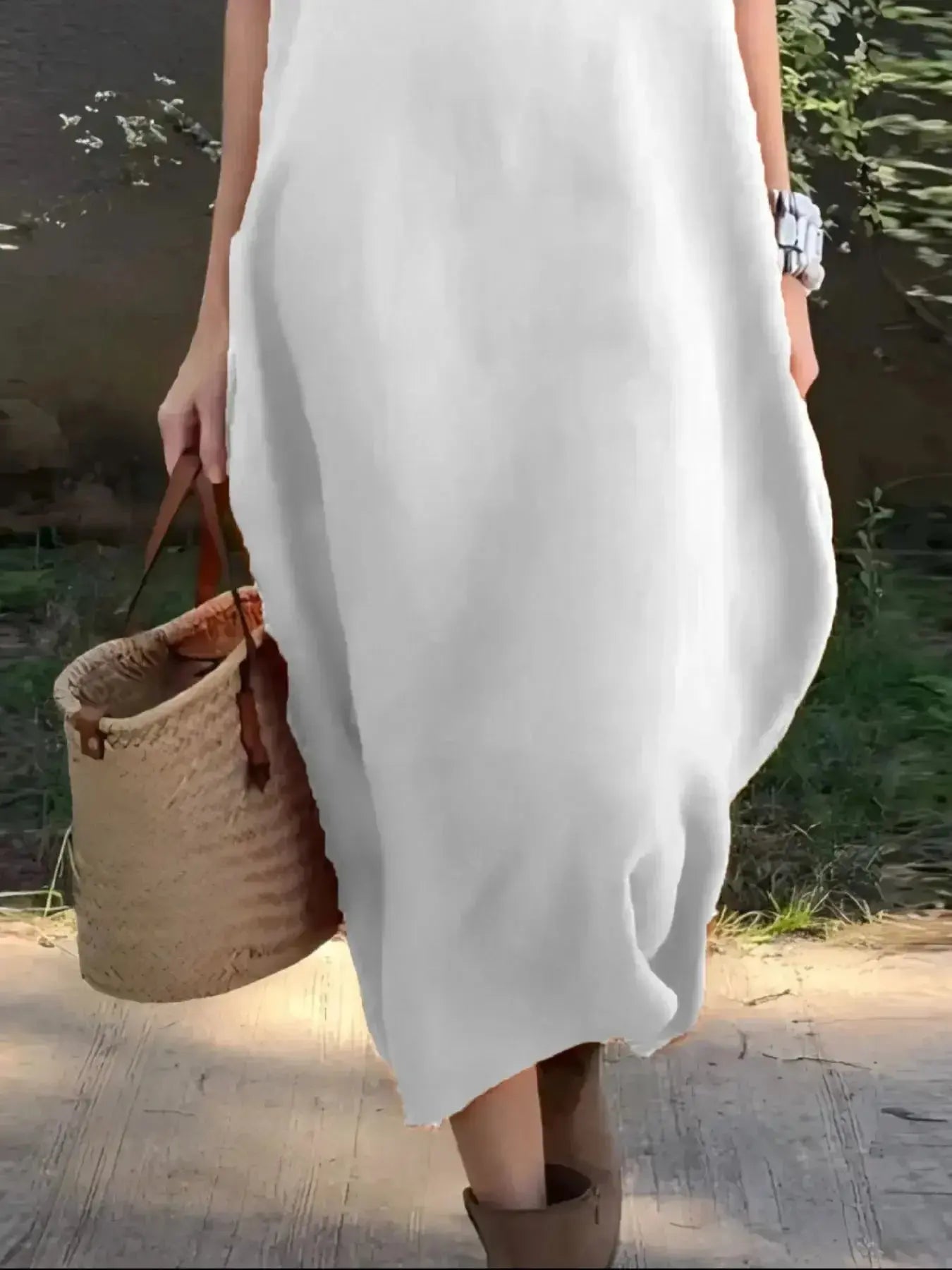 Full-length casual loose fit round neck midi dress with pockets by Plush Fashion Hub, suitable for plus-size women.