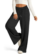 Full-length image of plush beige women's relaxed fit wide-leg drawstring lounge pants by Plush Fashion Hub.