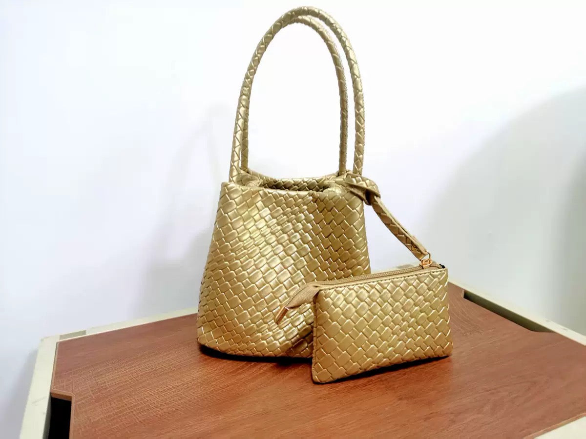 Hand-pressed woven tote bag by Plush Fashion Hub with sturdy handles and intricate woven design, perfect for everyday use.