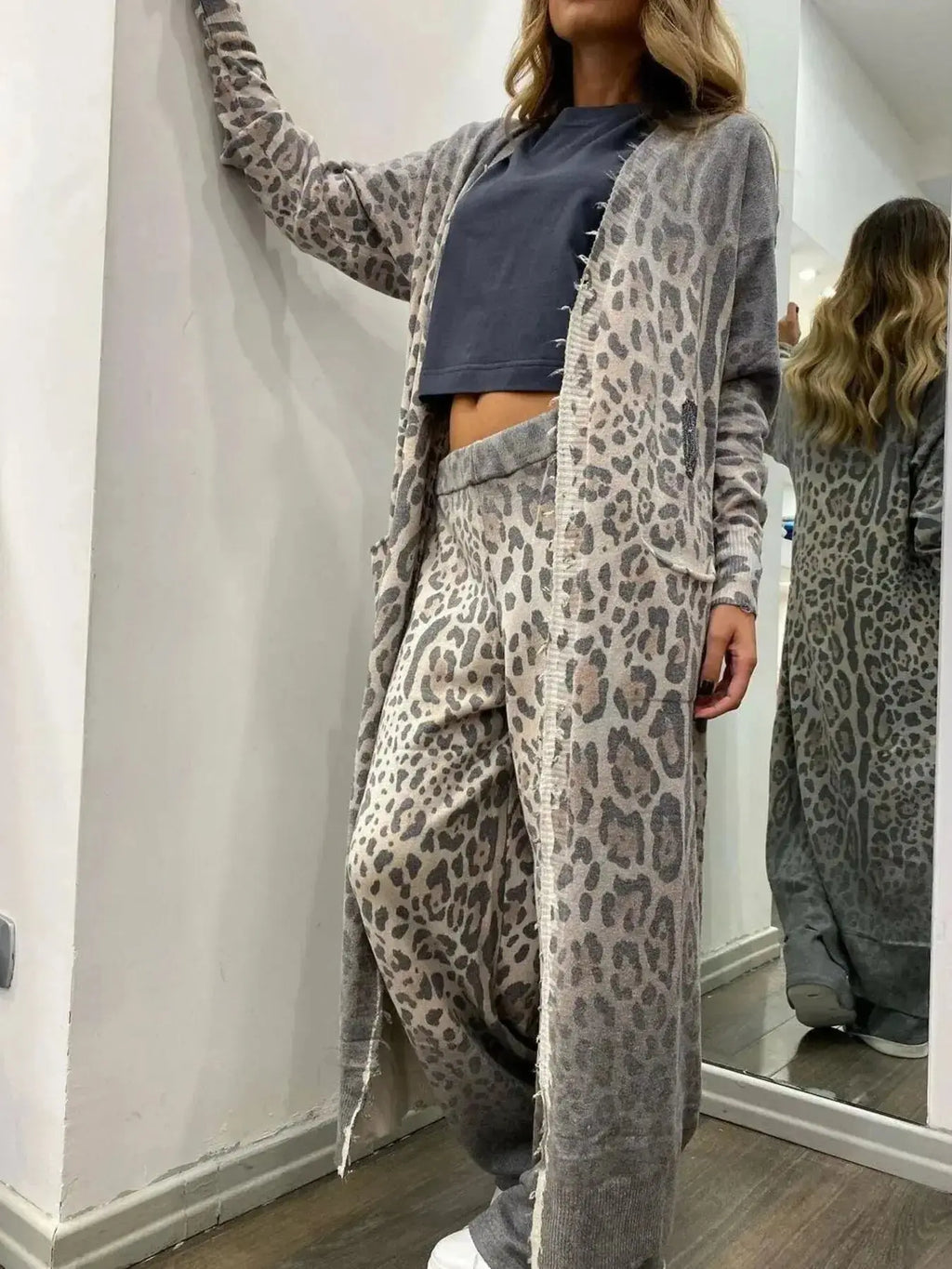 Women's long sleeve longline blazer and matching trousers 2-piece suit set from Plush Fashion Hub, shown in a stylish outfit.