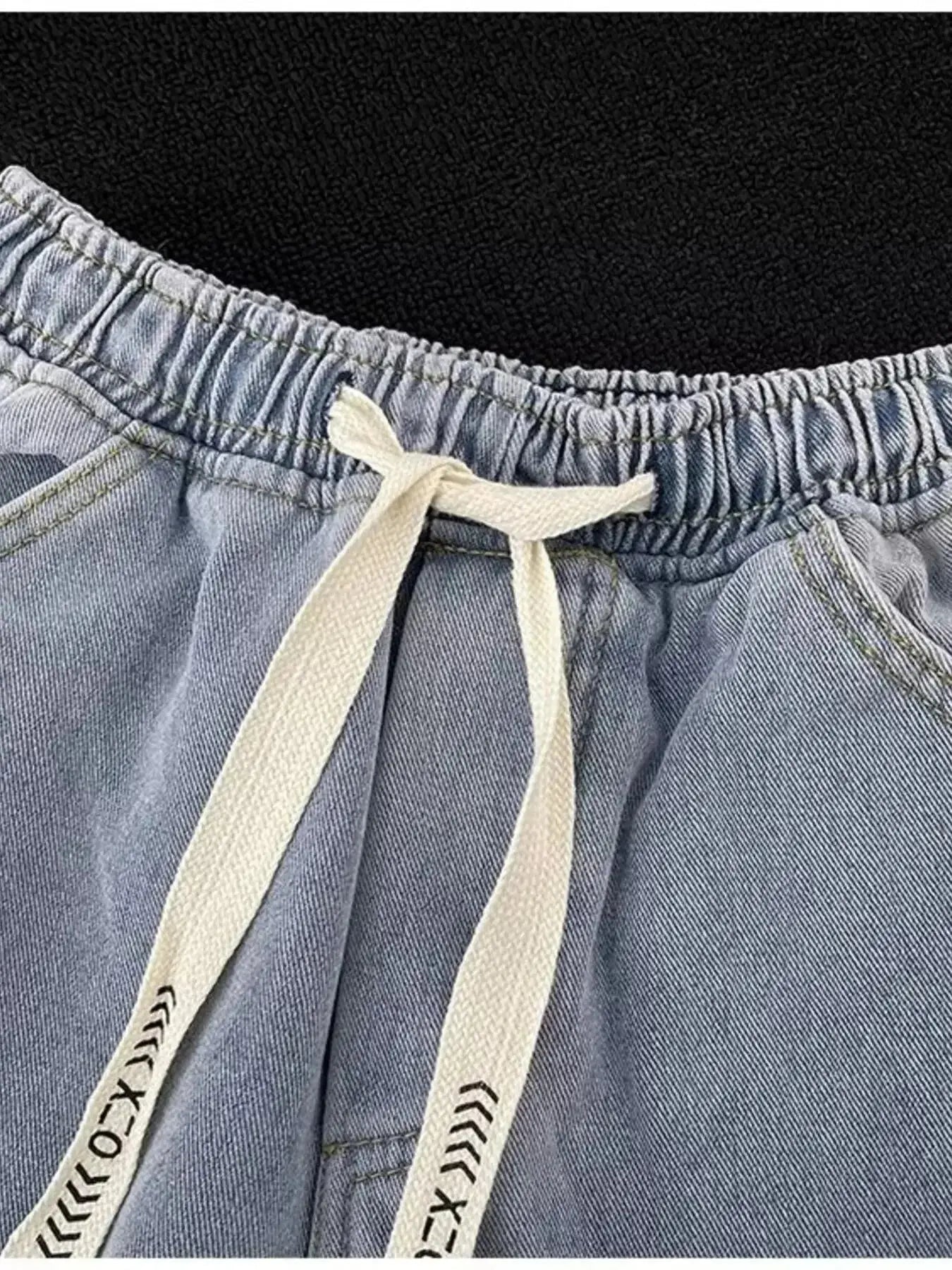 Men's wide leg washed denim jeans with adjustable drawstring waist from Trendsi, showcasing relaxed fit and casual style.