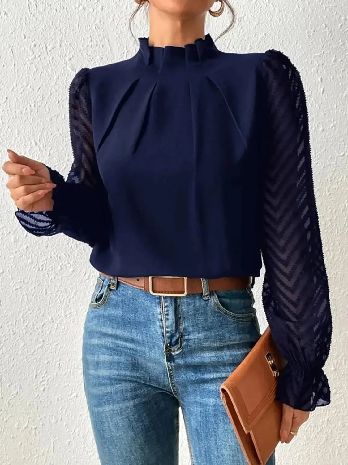 Elegant plush fabric mock neck blouse with flounce sleeves from Plush Fashion Hub, displayed on a hanger.