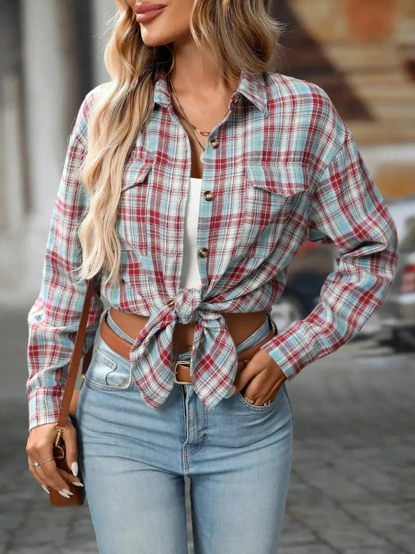 Oversized women's plaid button-down shirt by Trendsi, soft casual flannel top featuring a relaxed fit and classic check pattern.