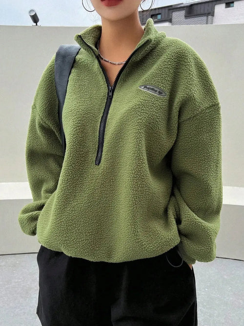 Women's half zip fleece sweatshirt with patch detail and drop shoulder design by Plush Fashion Hub, showcasing cozy fleece fabric.