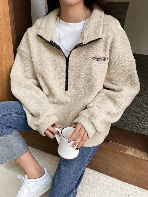 Women's half zip fleece sweatshirt with patch detail and drop shoulder design by Plush Fashion Hub.