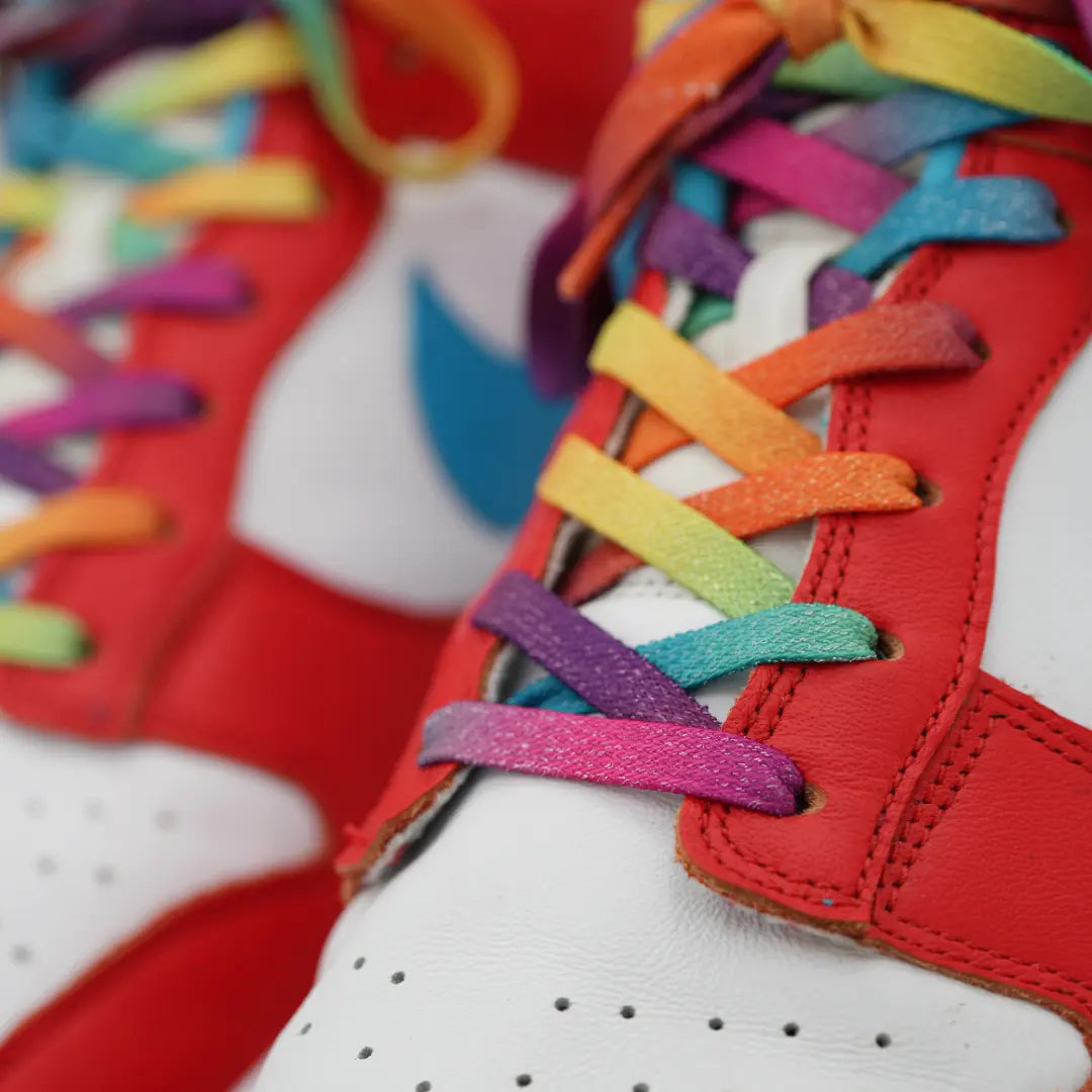 Close-up of Bread Prime Rainbow elastic shoelace featuring sparkly rainbow colors and a flexible, stylish design for sneaker laces.