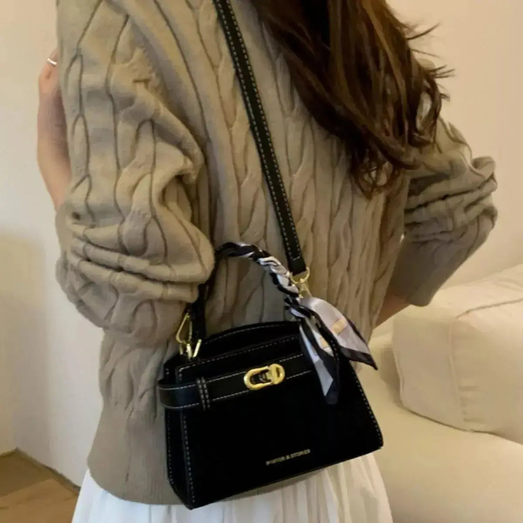 Premium suede mini crossbody bag with adjustable leather strap from Plush Fashion Hub, featuring a sleek compact design.