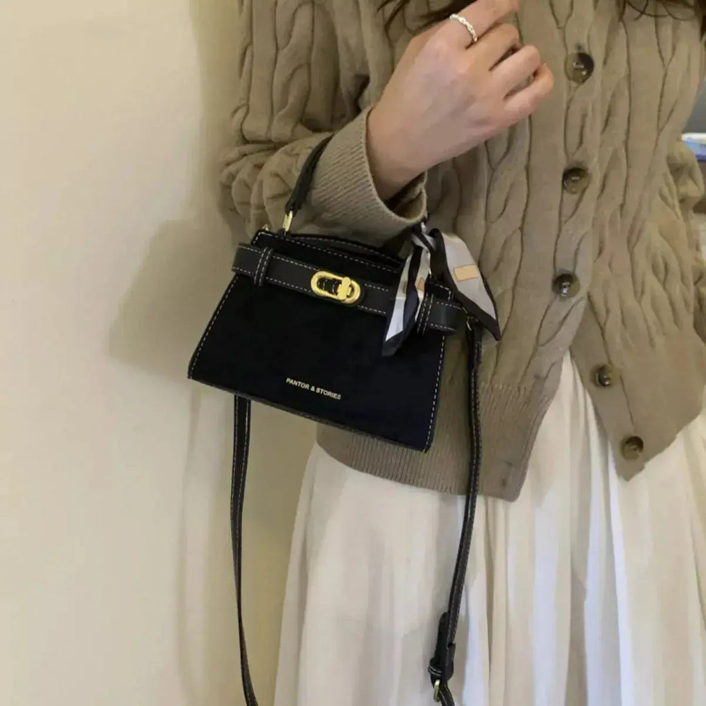Plush Fashion Hub premium suede mini crossbody bag with an adjustable leather strap, showcasing its compact design and stylish craftsmanship.